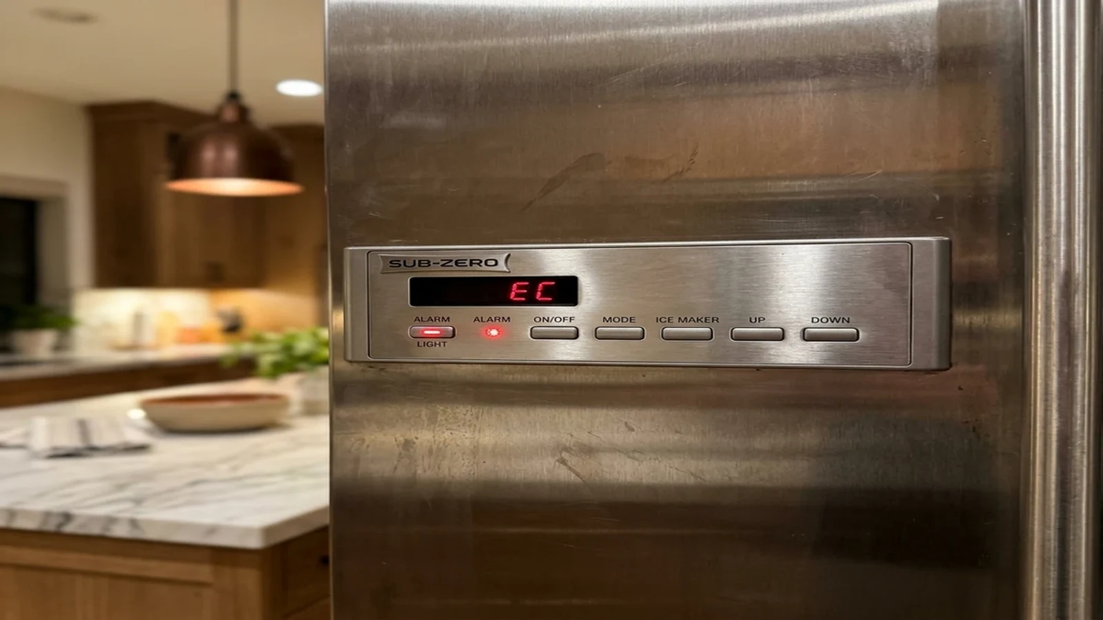 Sub-Zero control panel with its alarm light on in a Scottsdale Ranch kitchen